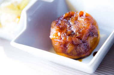 Tarte Tatin is a variant of apple pie in which the apples have been caramelized in butter and sugar before being incorporated into the dough.