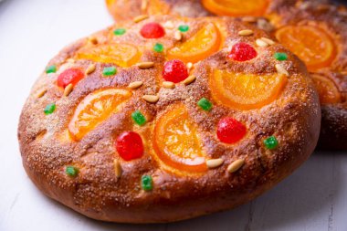 Coca de sant joan. Traditional San Juan cake to celebrate the arrival of summer in Spain made with brioche bread, candied fruit and nuts.
