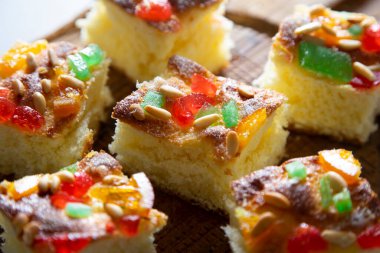 Coca de sant joan. Traditional San Juan cake to celebrate the arrival of summer in Spain made with brioche bread, candied fruit and nuts. clipart