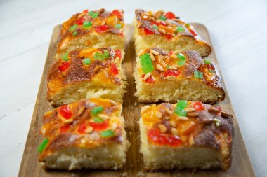 Coca de sant joan. Traditional San Juan cake to celebrate the arrival of summer in Spain made with brioche bread, candied fruit and nuts.
