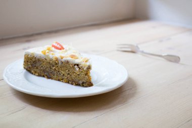 Carrot cake is a sweet cake with mashed carrots mixed into the batter. The carrot softens in the baking process, and the cake usually has a dense, smooth texture.