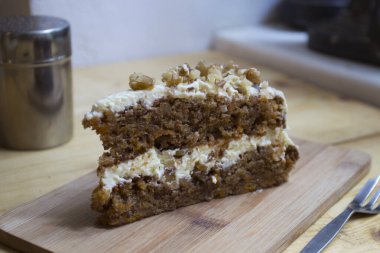 Carrot cake is a sweet cake with mashed carrots mixed into the batter. The carrot softens in the baking process, and the cake usually has a dense, smooth texture.