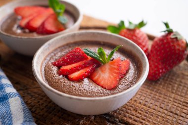 Chocolate mousse is a dessert of French origin, whose base is egg white mounted until stiff, or whipped milk cream, which give it a spongy consistency.