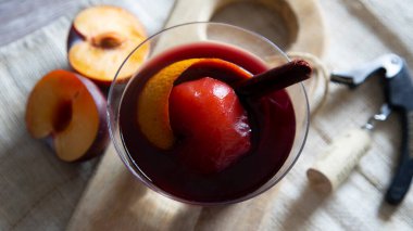 Peach cooked in red wine with cinnamon. Traditional Spanish recipe.