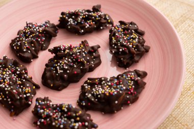Chocolate rocks with toasted almonds. Traditional Spanish dessert.