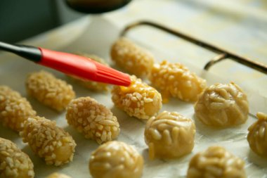 Penellets. Small sweets of various shapes, made from almond and potato dough, and covered with almonds or pine nuts.