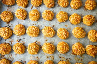Penellets. Small sweets of various shapes, made from almond and potato dough, and covered with almonds or pine nuts.