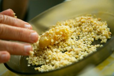 Penellets. Small sweets of various shapes, made from almond and potato dough, and covered with almonds or pine nuts.