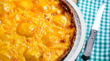 Peach cake made with a recipe with yogurt and fresh fruit.