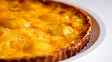 Peach cake made with a recipe with yogurt and fresh fruit.