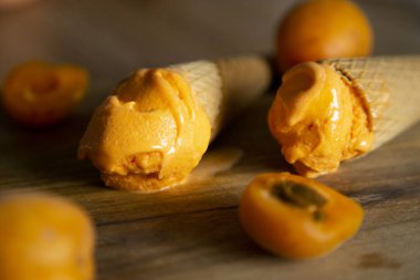 Artisan italian apricot ice cream in a cone in Sicily,