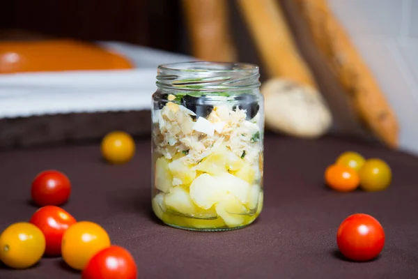 Potato and onion salad served in a crystal glass