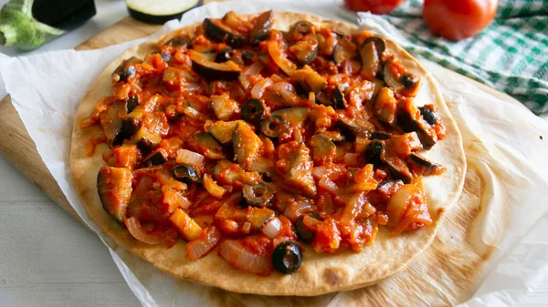 stock image Neapolitan pizza with roasted eggplant and Italian tomato sauce.