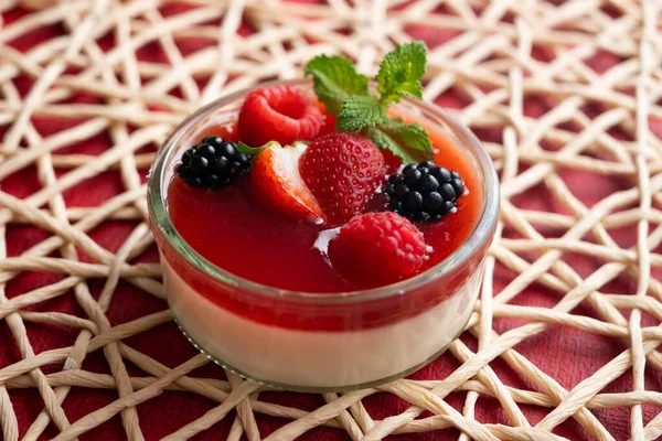 Panna cotta is a typical dessert from the Italian region of Piedmont, made from milk or cream, sugar and gelling agents, which is usually garnished with red fruit jams.