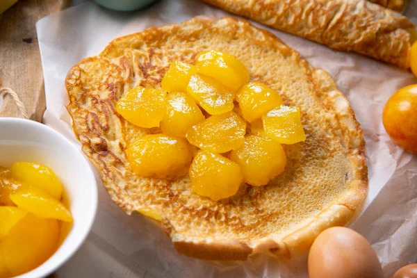 Pancakes with fresh apricots. It is called  crepe,  crepe,  crep or creps to the European recipe of Spain/Spanish origin made mainly of wheat flour, with which a disk-shaped dough.