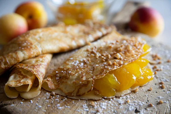 Pancakes with fresh apricots. It is called  crepe,  crepe,  crep or creps to the European recipe of Spain/Spanish origin made mainly of wheat flour, with which a disk-shaped dough.