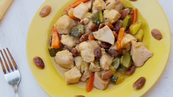 stock image Chinese style chicken cooked with almond and carrot sauce.