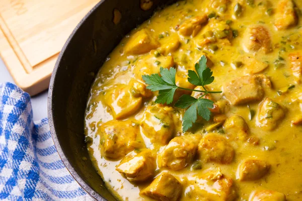 Chicken recipe with curry sauce and coconut.