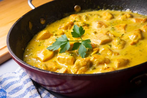 stock image Chicken recipe with curry sauce and coconut.