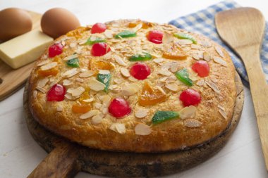 Coca de sant joan. Traditional San Juan cake to celebrate the arrival of summer in Spain made with brioche bread, candied fruit and nuts.