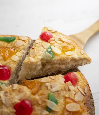 Coca de sant joan. Traditional San Juan cake to celebrate the arrival of summer in Spain made with brioche bread, candied fruit and nuts.