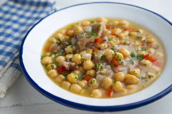 Stewed chickpeas with pig\'s feet. Traditional recipe from northern Spain.