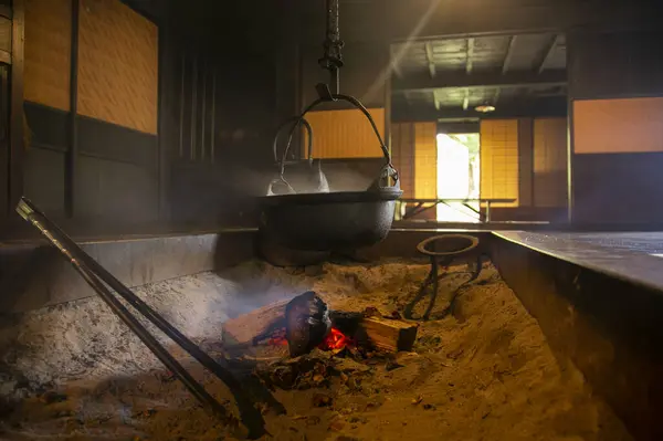 Japanese iron pot with water heated with fire in a living room of a traditional house in Tokyo.