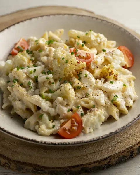 Macaroni cooked with cream, cheese and baked cauliflower.