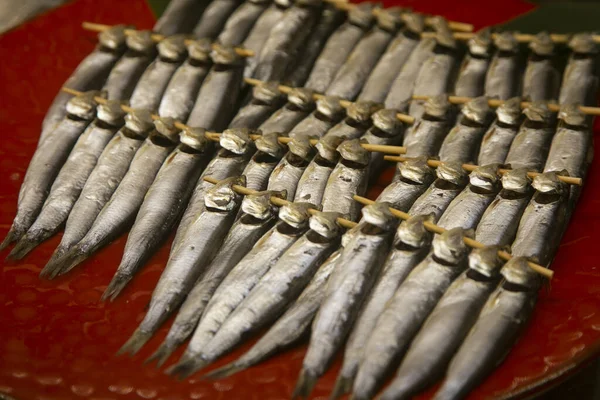 Ayu River fish at a food stall at the Tsukiji Outer Market in the city of Tokyo in Japan.