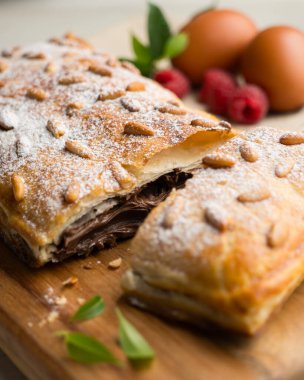 Chocolate San Juan Coca. Traditional San Juan cake to celebrate the arrival of summer in Spain made with puff pastry and cocoa cream. clipart