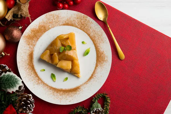 stock image Delicious tarte tatin with apples from an overhead perspective. Food on a Christmas table.