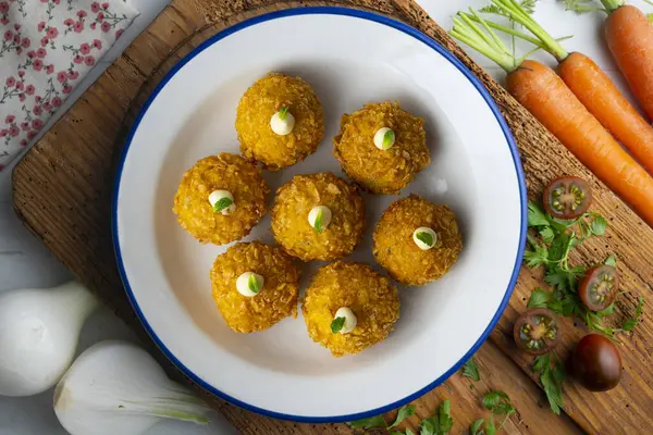 stock image Spanish Tapa croquettes made with bechamel sauce and stuffed fish and mayonnaise. Top view table with christmas decoration.