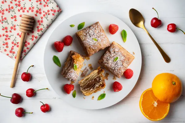 stock image Miguelitos are typical pastries from Spain made from puff pastry. Top view table with  decoration.