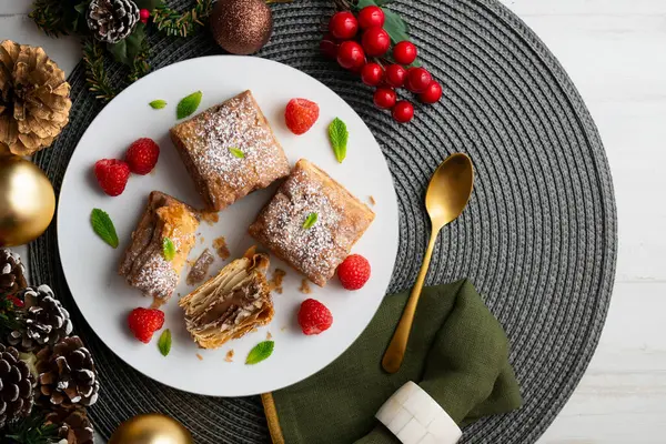 stock image Miguelitos are typical pastries from Spain made from puff pastry. Top view table with christmas decoration.