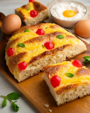 Coca de sant joan. Traditional San Juan cake to celebrate the arrival of summer in Spain made with brioche bread, candied fruit and nuts.