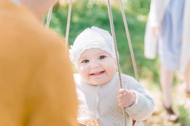 close-up portrait of a cute green-eyed boy of three years looking with interest and smiling. Front view, close up, vertical image