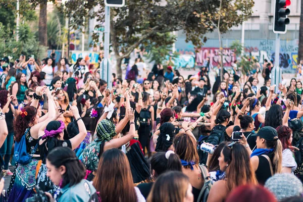 stock image group of people walking in front of big crowd of audience