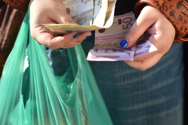 Woman Counting Serbian Dinars Plastic Bag Her Hands — 스톡 사진