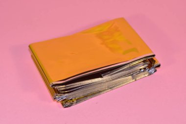 First aid kit rescue blanket on a pink background medical