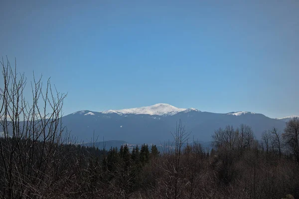 Landscape of snow covered mountains in spring