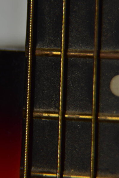 Close up of acoustic guitar strings. Extreme macro shot of instrument strings of acoustic guitar.