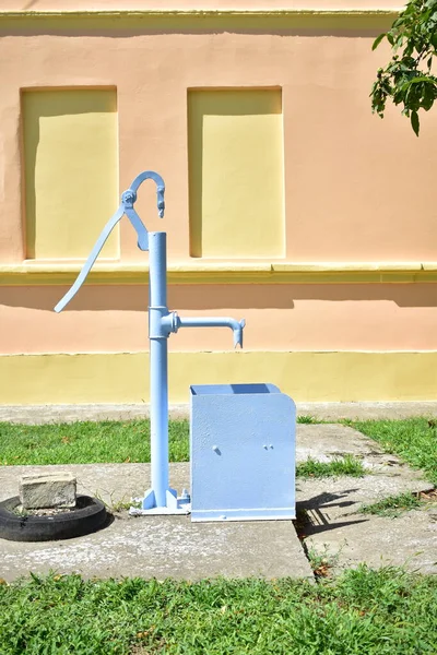 Old hand water pump in the village