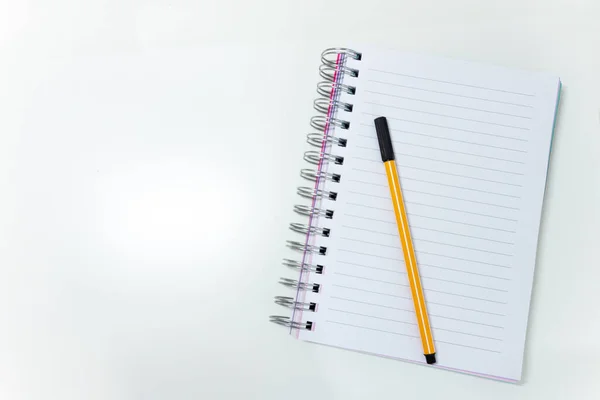 stock image Top view of desktop with a notebook. White background