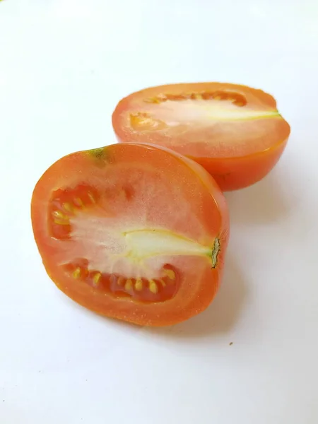 Close-up of Halved tomato on white background. Isolated