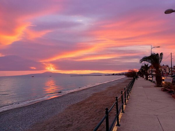 Sunset on the beach (Navarinou) of Kalamata, a city in Southern Greece in the Peloponnese, June 2025