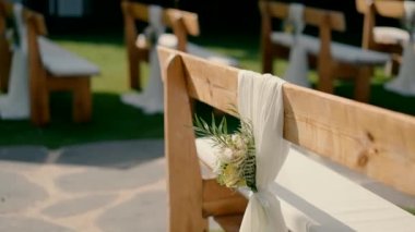 An arched bench at a wedding. High quality FullHD footage