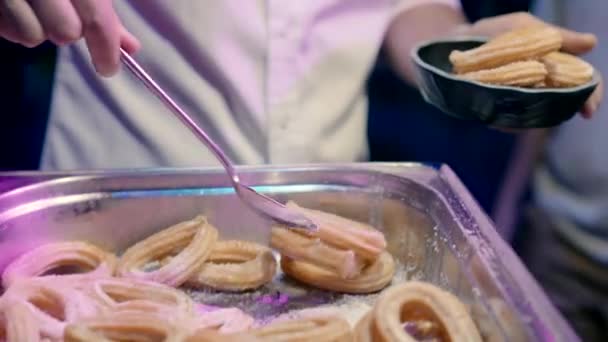 Man Puts Sweet Pastries His Plate High Quality Fullhd Footage — Stock Video