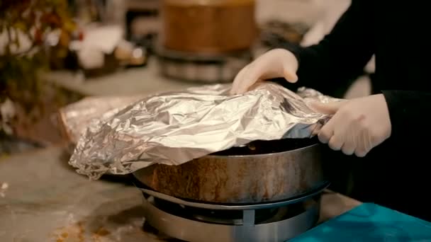 Close Slow Motion Video Shot Waiter Lifting Foil Cooking Pot — Stock Video