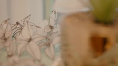 earrings, beads, bracelets and other jewelry are neatly arranged on a shelf. video shooting slow motion. jewelry and jewelry for women for celebrations and festivities