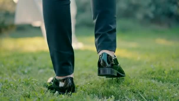 Close Slow Motion Shot Legs Groom Approaching Bride Standing Green — Video Stock